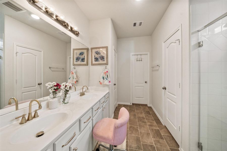 Double sinks with plenty of counter space in the primary bathroom