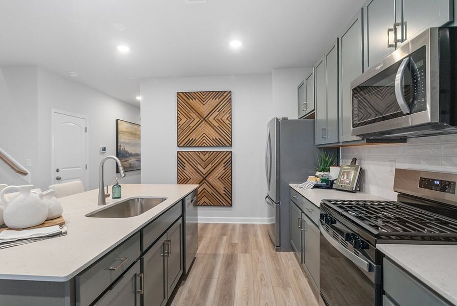 A kitchen with stainless steel appliances. A kitchen with stainless steel appliances.