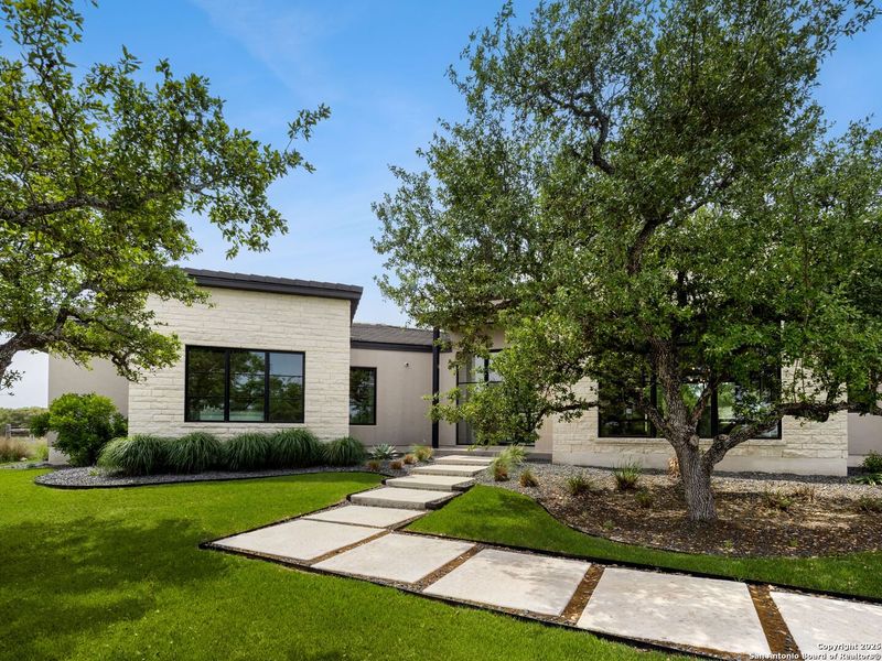 Front exterior of a new home in , Boerne, TX, highlighting curb appeal (Image 19).