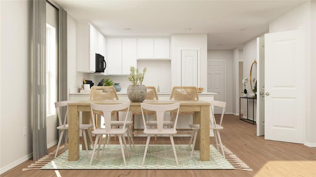 Dining space with light wood-type flooring