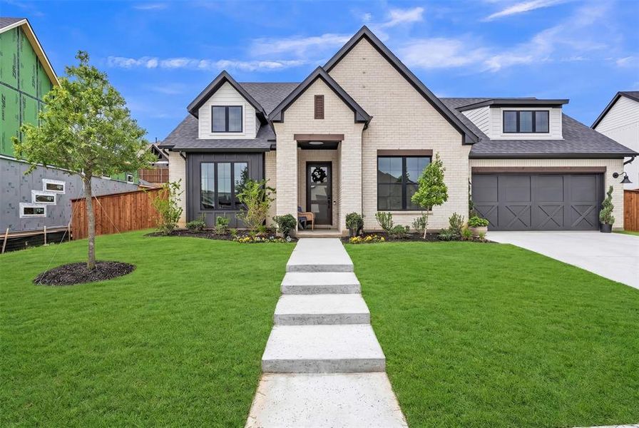 Front exterior of a new home in Sweetgrass, Haslet, TX, highlighting curb appeal (Image 1). Front exterior of a new home in Sweetgrass, Haslet, TX, highlighting curb appeal (Image 1).