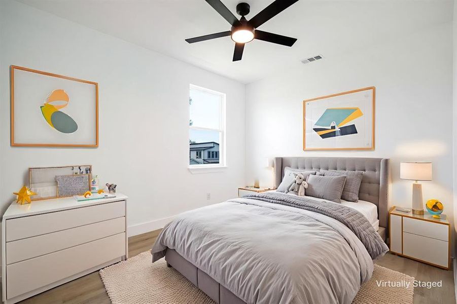 Bedroom featuring wood finished floors and a ceiling fan