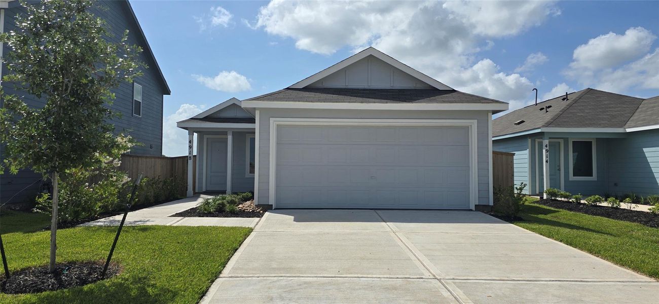 Front exterior of a new home in Esperanza, Richmond, TX, highlighting curb appeal (Image 2).