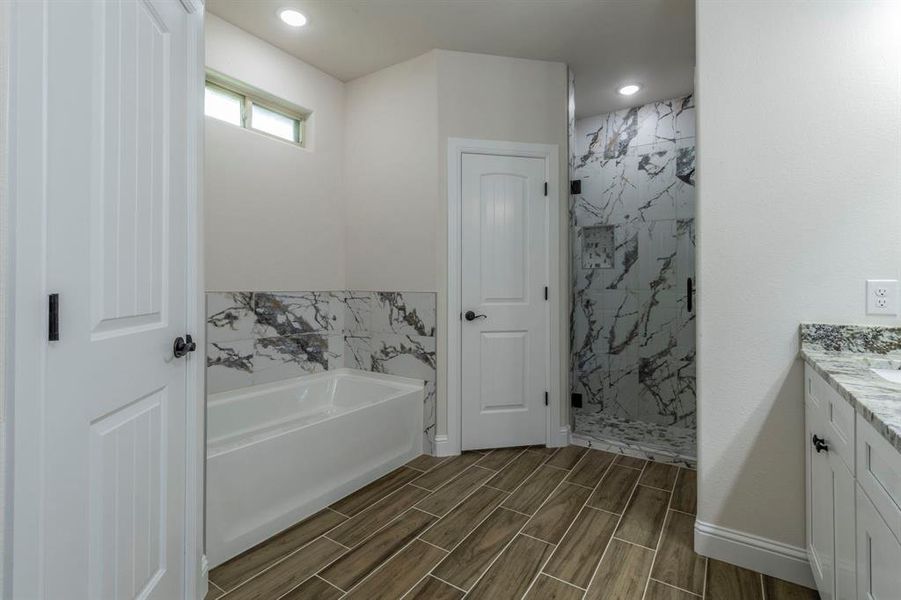 Soaking Tub with beautiful decorative tile.