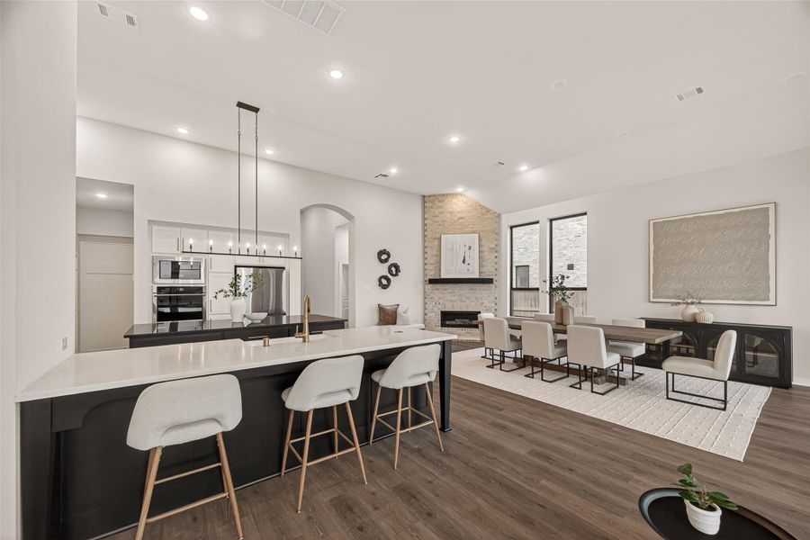 Open concept design with the kitchen open to the family and dining rooms.