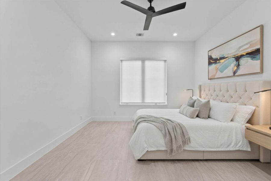 Large windows invite natural light into this well-appointed suite.