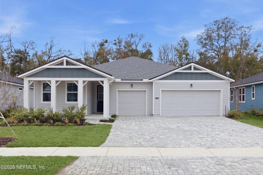 Front exterior of a new home in RiverTown, St. Johns, FL, highlighting curb appeal (Image 14). Front exterior of a new home in RiverTown, St. Johns, FL, highlighting curb appeal (Image 14).