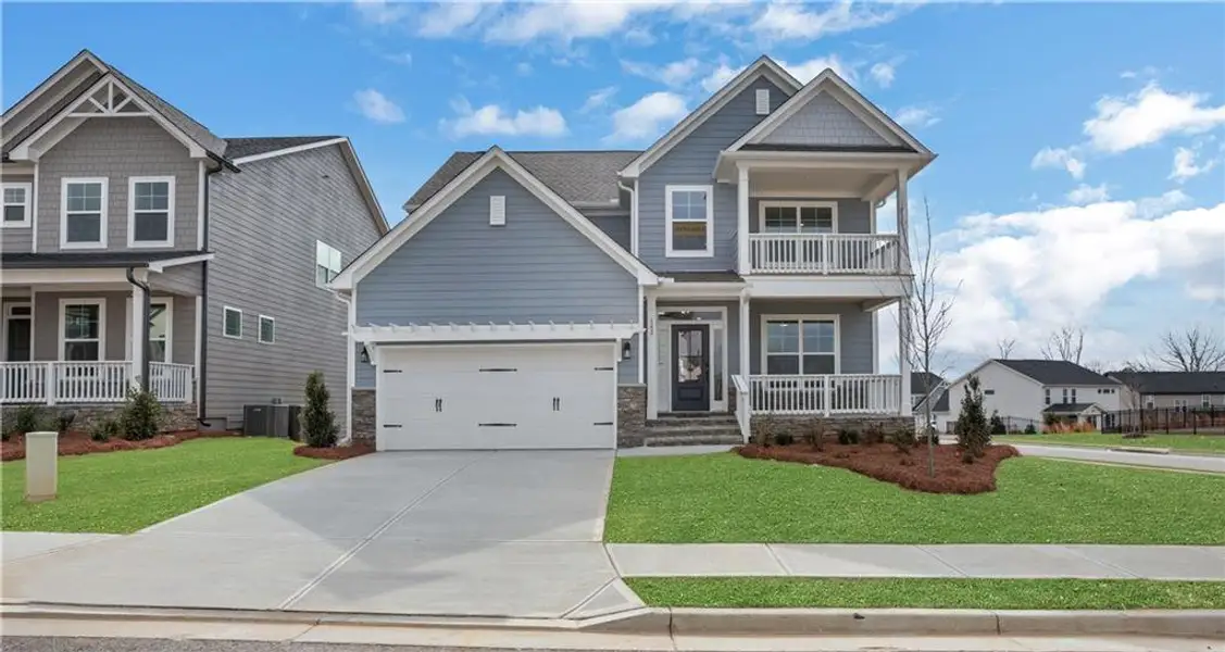 Front exterior of a new home in Twin Lakes, Hoschton, GA, highlighting curb appeal (Image 2). Front exterior of a new home in Twin Lakes, Hoschton, GA, highlighting curb appeal (Image 2).