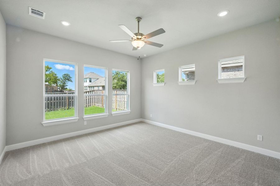 Spare room featuring light carpet, recessed lighting, and a ceiling fan Spare room featuring light carpet, recessed lighting, and a ceiling fan
