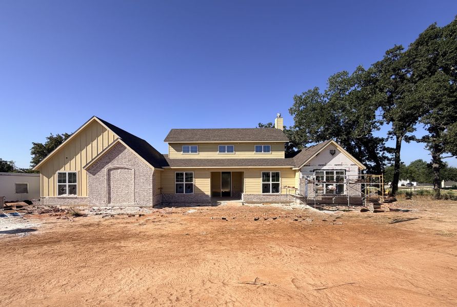 Front exterior of a new home in Monarch Manor, Poolville, TX, highlighting curb appeal (Image 4).