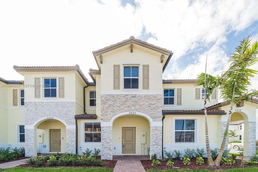 Front exterior of a new home in , Homestead, FL, highlighting curb appeal (Image 17).