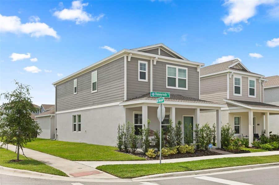 Front exterior of a new home in Rivington, Debary, FL, highlighting curb appeal (Image 19).
