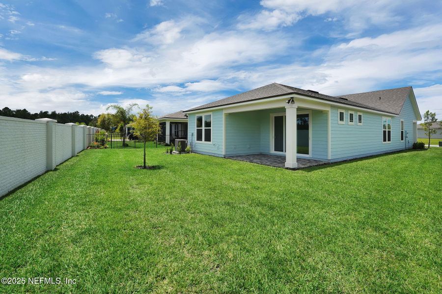 Exterior details and patio area of a home in Summer Bay at Grand Oaks, St. Augustine (Image 21). Exterior details and patio area of a home in Summer Bay at Grand Oaks, St. Augustine (Image 21).