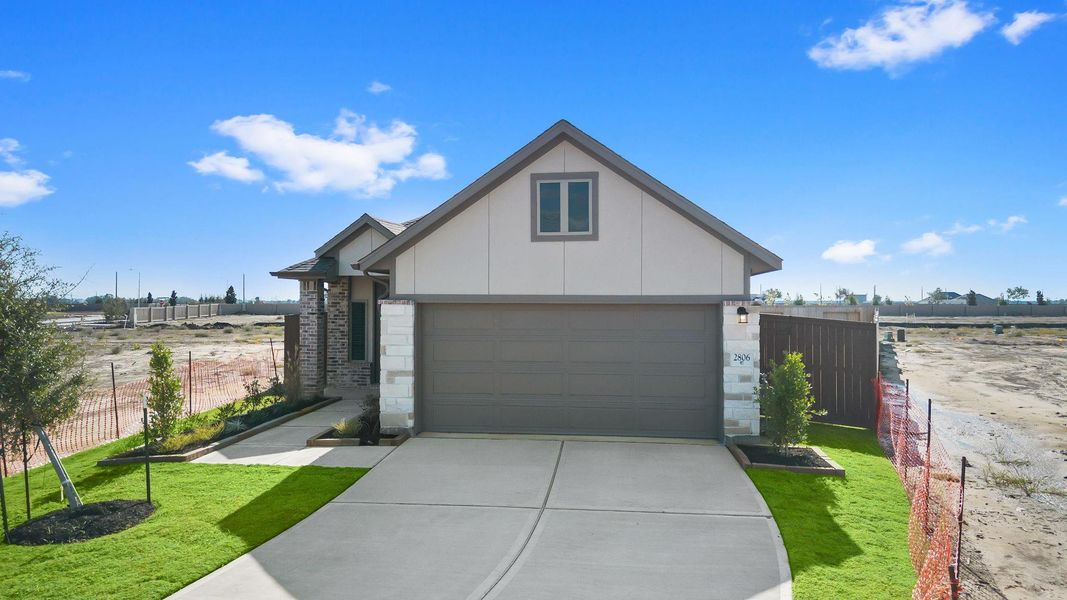 Front exterior of a new home in Creekhaven, Rosharon, TX, highlighting curb appeal (Image 2). Front exterior of a new home in Creekhaven, Rosharon, TX, highlighting curb appeal (Image 2).
