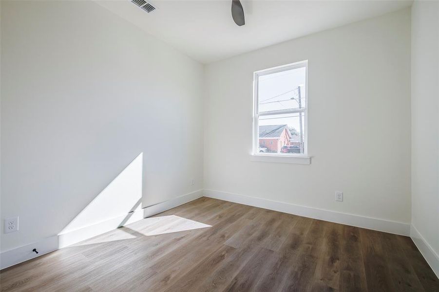 Spare room with hardwood / wood-style floors