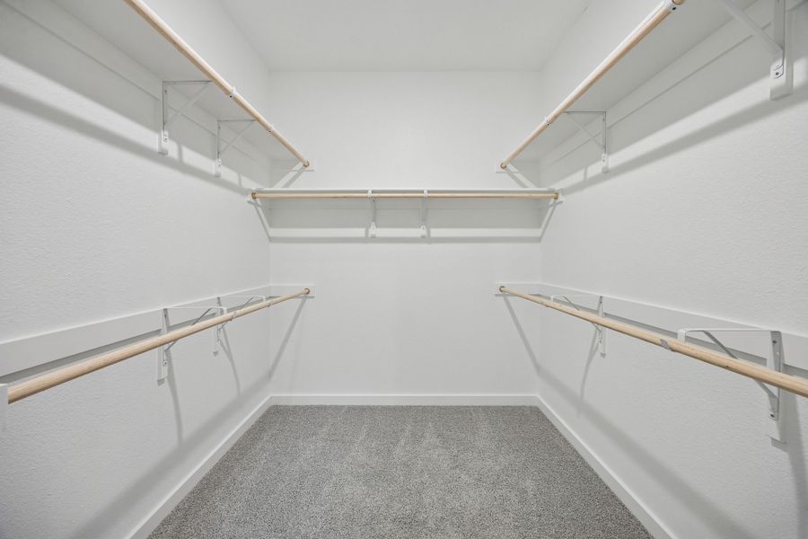Primary Closet in the Masters home plan by Trophy Signature Homes – REPRESENTATIVE PHOTO