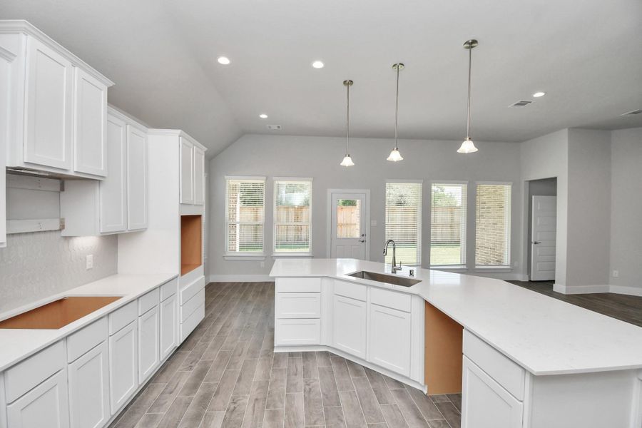 This generously spacious kitchen is a dream realized! Sample photo of completed home with similar floor plan. Actual colors and selections may vary. This generously spacious kitchen is a dream realized! Sample photo of completed home with similar floor plan. Actual colors and selections may vary.