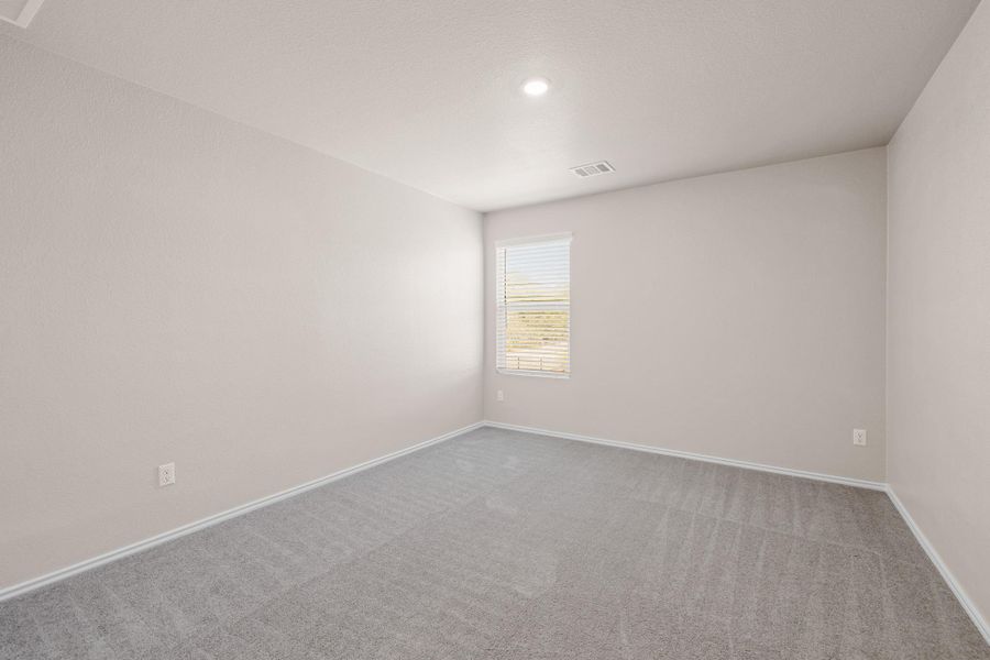 Carpeted empty room with baseboards