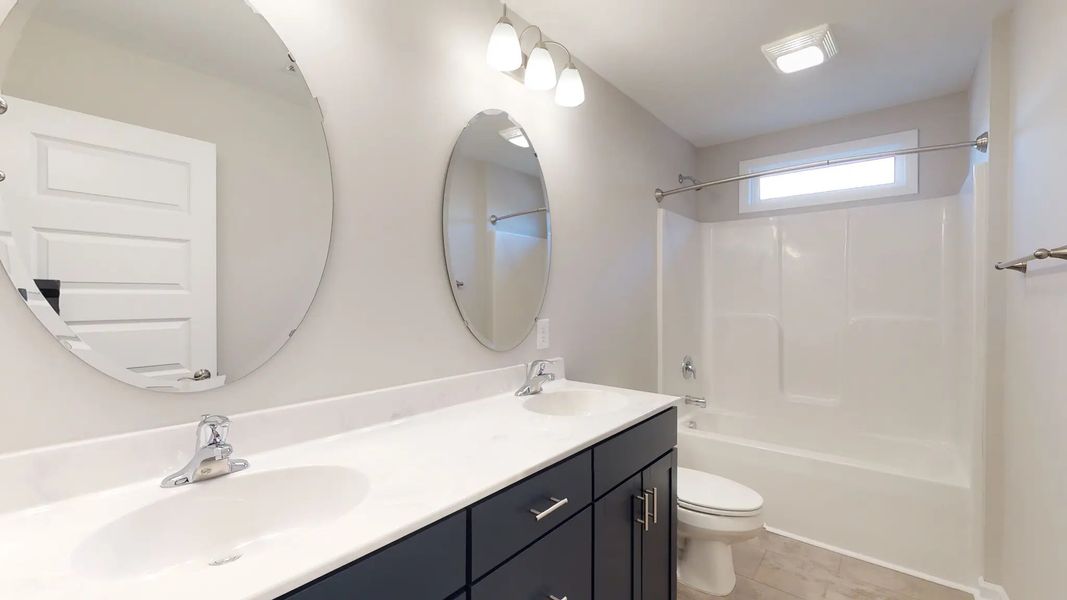 Representative furnished interior of a home built from the Westin A by JC Jackson Homes,LLC in Heritage Pointe, Newport (Image 8).