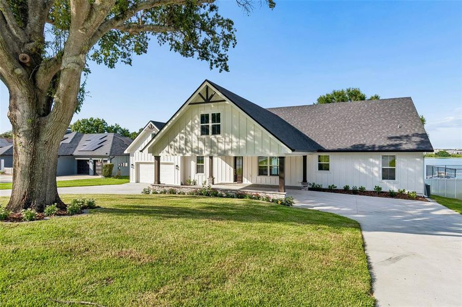Front exterior of a new home in , Auburndale, FL, highlighting curb appeal (Image 28). Front exterior of a new home in , Auburndale, FL, highlighting curb appeal (Image 28).