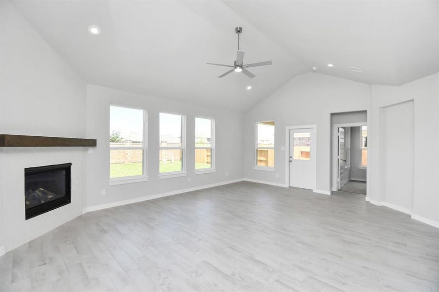 Take another glimpse into the heart of the home with this additional view of the family room—a sprawling space ready to accommodate all your gatherings. Photo shown is example of completed home with similar plan. Actual colors and selections may vary.