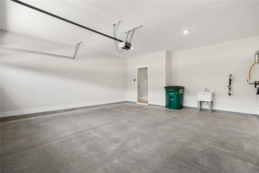 A well-maintained garage offers ample space and es A well-maintained garage offers ample space and es