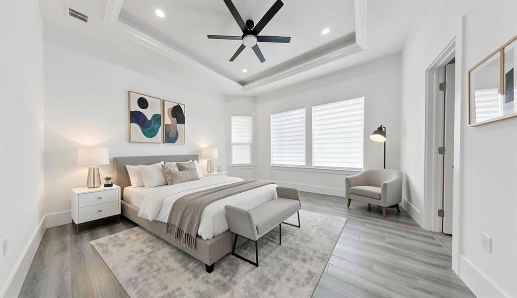 Recessed lighting illuminates a tray ceiling with crown molding Recessed lighting illuminates a tray ceiling with crown molding