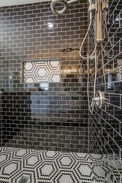 Bathroom featuring tiled shower