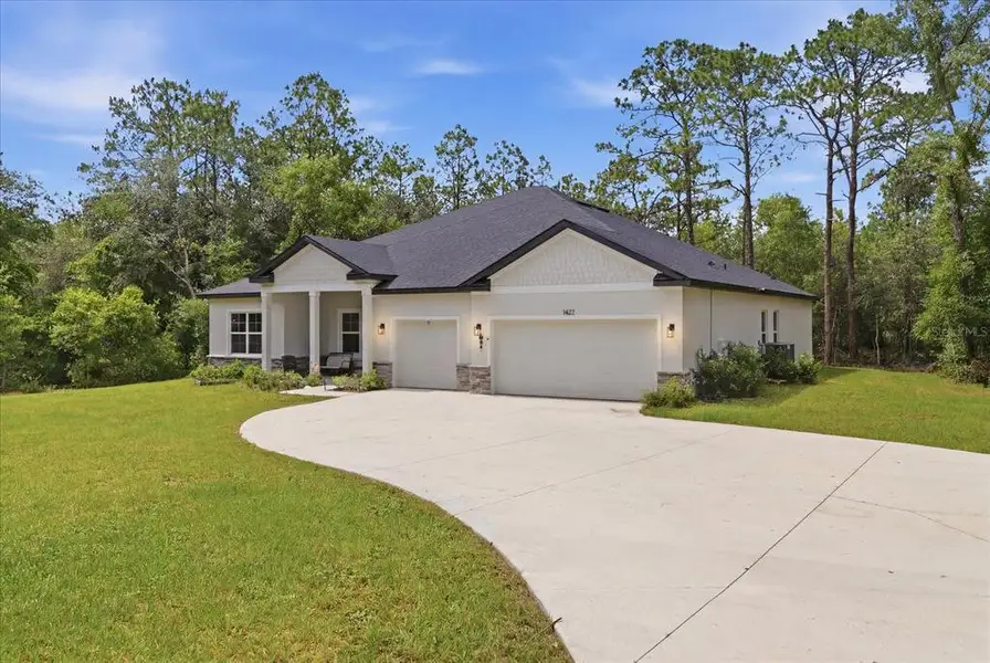 Front exterior of a new home in , Hernando, FL, highlighting curb appeal (Image 2). Front exterior of a new home in , Hernando, FL, highlighting curb appeal (Image 2).