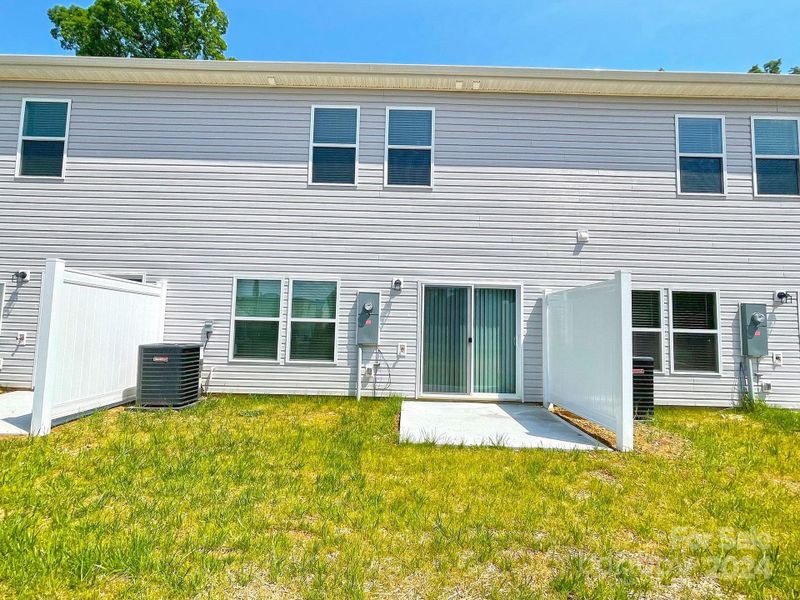 Back of unit with patio & privacy fences