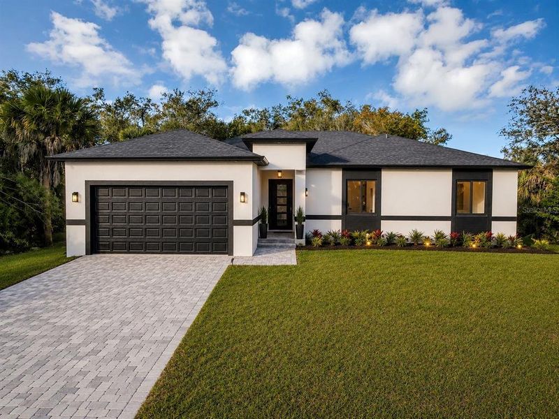 Front exterior of a new home in , Port Charlotte, FL, highlighting curb appeal (Image 30). Front exterior of a new home in , Port Charlotte, FL, highlighting curb appeal (Image 30).
