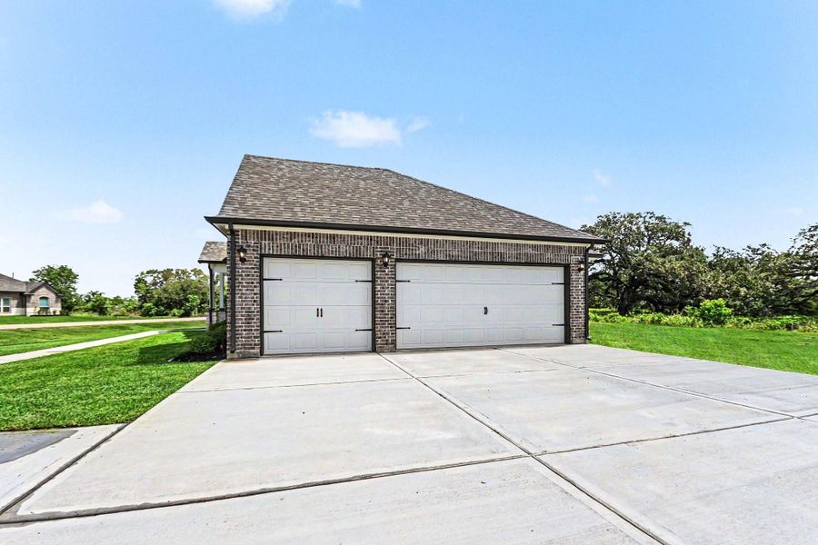 Front exterior of a new home in Little River Ranch, Bay City, TX, highlighting curb appeal (Image 2). Front exterior of a new home in Little River Ranch, Bay City, TX, highlighting curb appeal (Image 2).