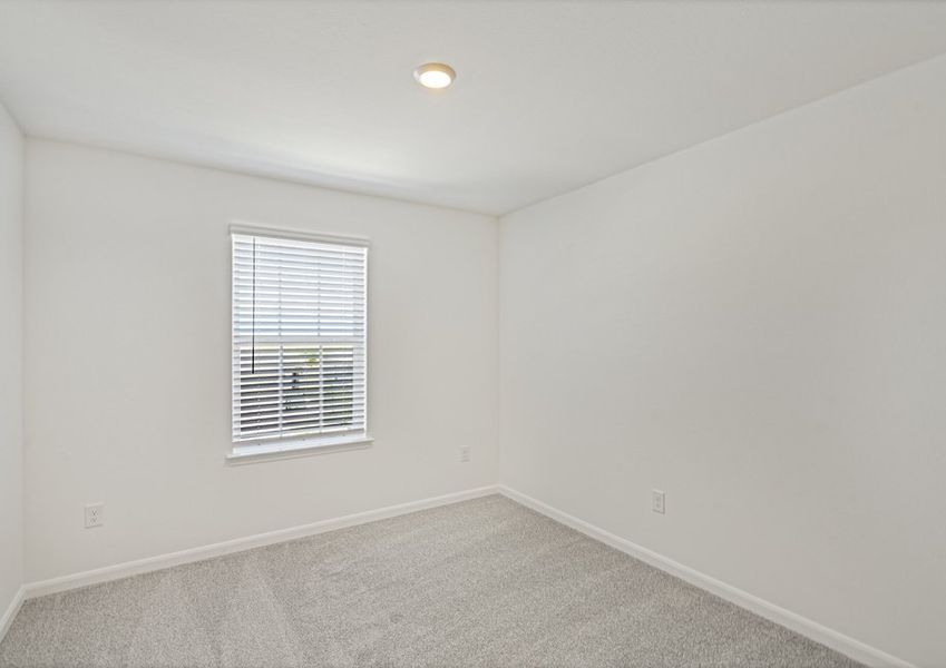 Secondary bedroom with lush carpet flooring Secondary bedroom with lush carpet flooring
