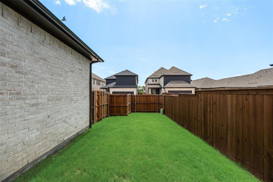 Exterior details and patio area of a home in The Grove Frisco - 40' Lots, Frisco (Image 21).