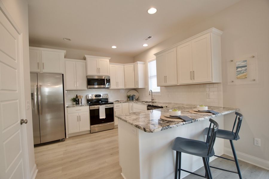 Furnished interior view inside a new home in Showcase Homes Burgaw & St. Helena, Burgaw (Image 7).