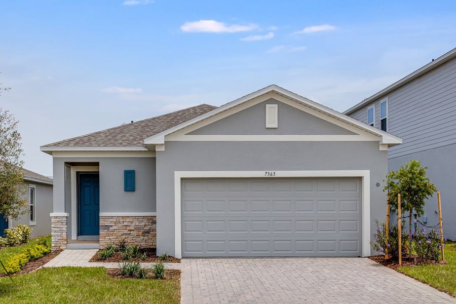 Representative exterior photo of a completed home built from the Spruce by Taylor Morrison in Palm Wind, Hudson, FL (Image 1).