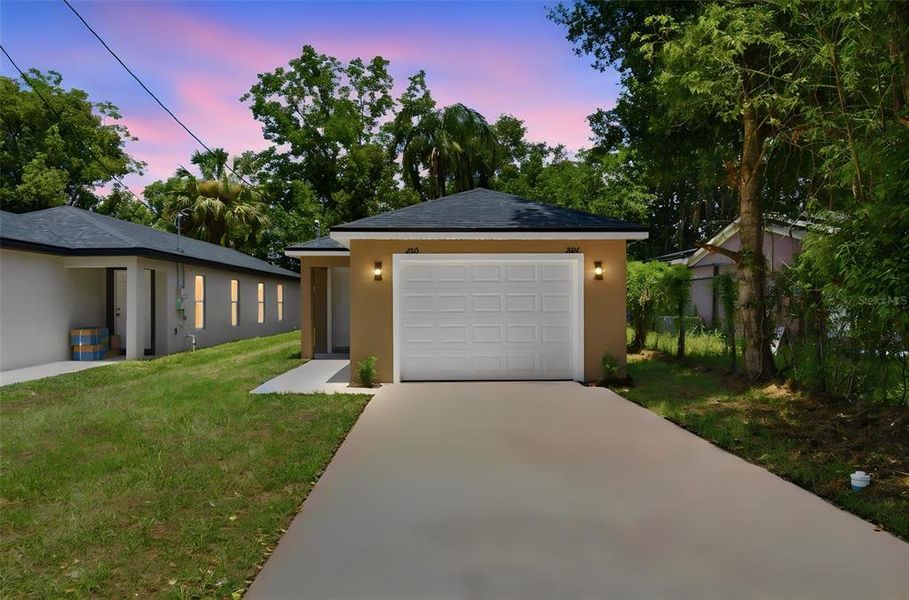 Front exterior of a new home in , Eustis, FL, highlighting curb appeal (Image 2). Front exterior of a new home in , Eustis, FL, highlighting curb appeal (Image 2).
