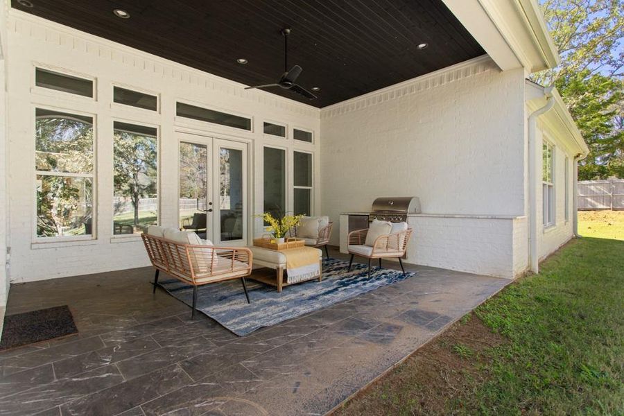 View of patio / terrace with a ceiling fan, french doors, an outdoor hangout area, and a grill