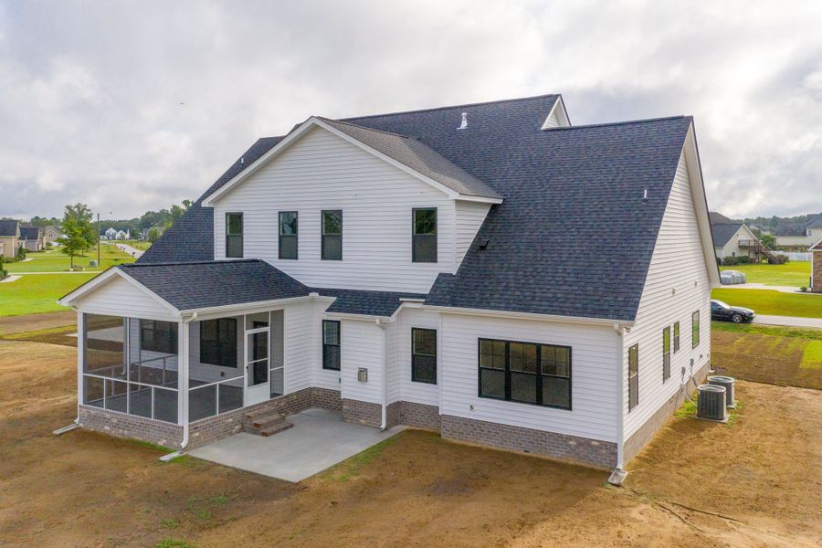 Representative exterior photo of a completed home built from the Carson by Bill Clark Homes in Cheshire Landing, Grimesland, NC (Image 34). Representative exterior photo of a completed home built from the Carson by Bill Clark Homes in Cheshire Landing, Grimesland, NC (Image 34).