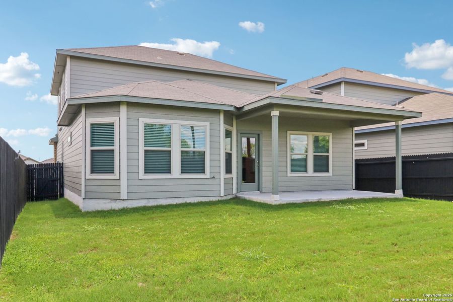 Front exterior of a new home in Remington Ranch, San Antonio, TX, highlighting curb appeal (Image 24). Front exterior of a new home in Remington Ranch, San Antonio, TX, highlighting curb appeal (Image 24).