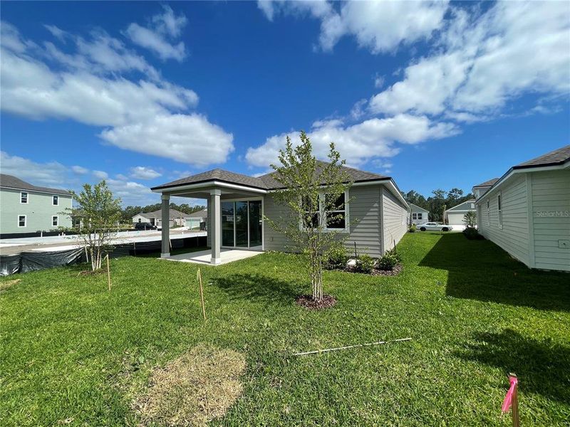 Front exterior of a new home in Palm Series at Seminole Palms, Palm Coast, FL, highlighting curb appeal (Image 14).