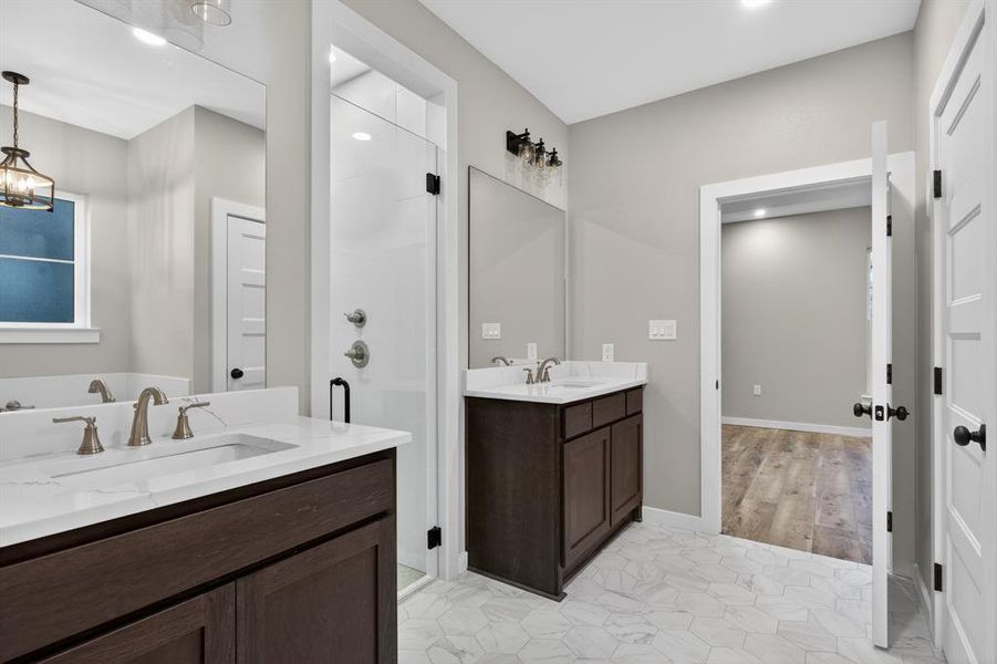View of primary bathroom leading into primary bedroom.