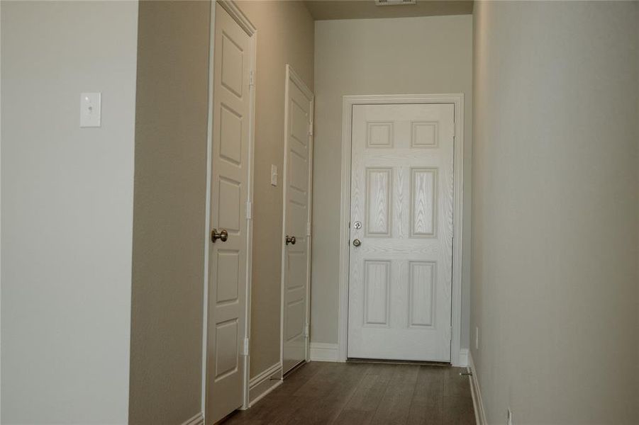 Hall featuring dark hardwood / wood-style floors