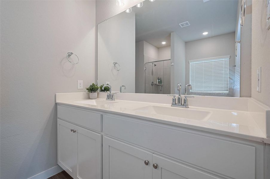 Full bathroom with modern vanity.