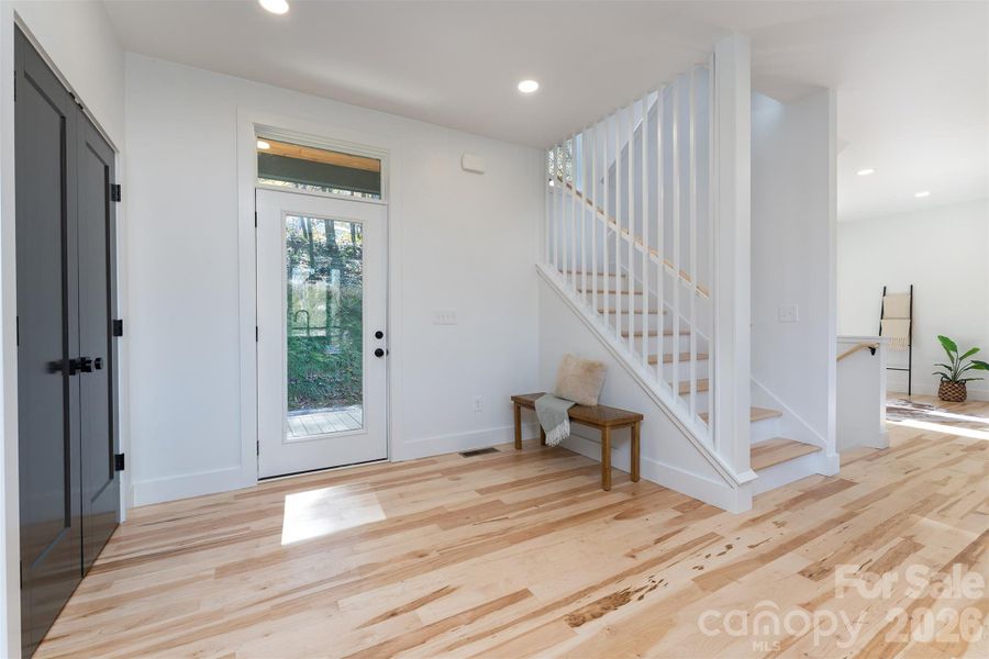 Upstairs features 3 bedrooms and 2 full bathrooms