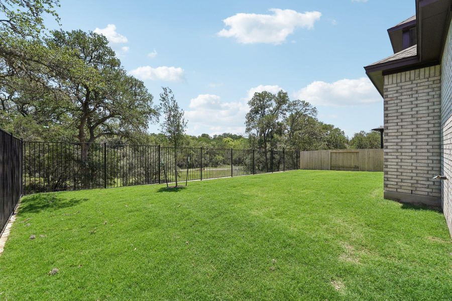 Exterior details and patio area of a home in Persimmon, Buda (Image 18).