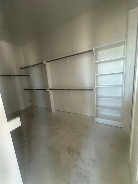 Primary closet conveniently connects to the utility room