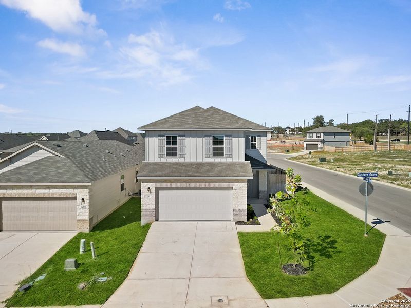 Front exterior of a new home in Veranda: Classic, San Antonio, TX, highlighting curb appeal (Image 2).