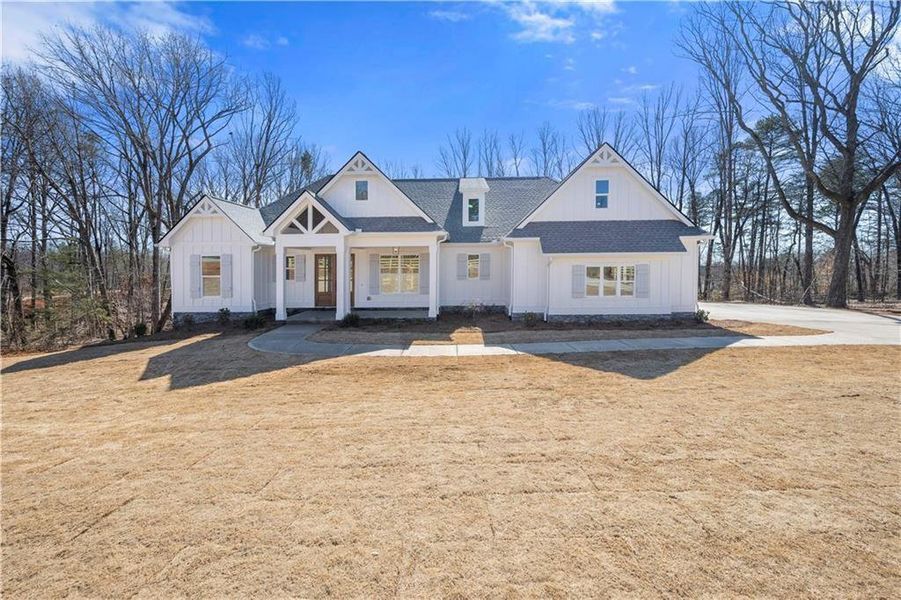 Front exterior of a new home in , Ball Ground, GA, highlighting curb appeal (Image 1). Front exterior of a new home in , Ball Ground, GA, highlighting curb appeal (Image 1).