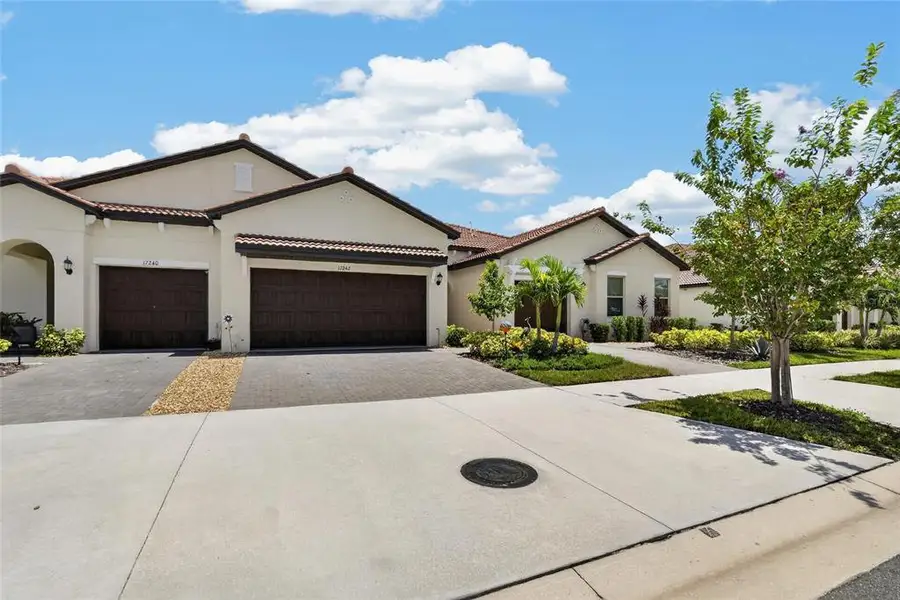Front exterior of a new home in Southshore Bay Active Adult, Wimauma, FL, highlighting curb appeal (Image 21).